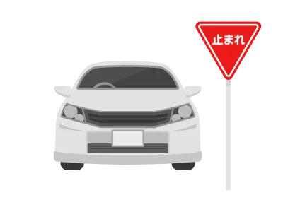 止まれの標識で一時停する自動車のイラスト