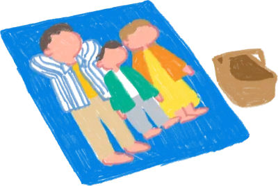 ピクニックに来ている家族