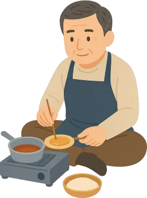 앉아서 달고나 만드는 아저씨