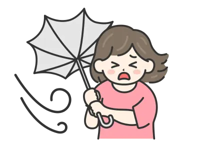 強風で傘が裏返ってしまった私服姿の女性のイラスト