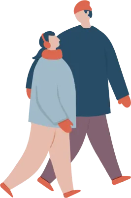 冬の服装で歩いているカップル