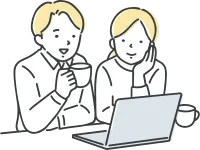 パソコンを見ている若いカップル