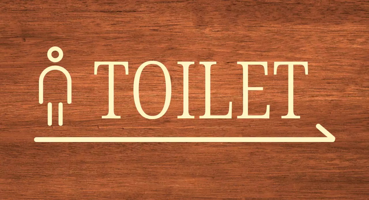 Beigefarbenes Mann-Symbol Standort der Toilette