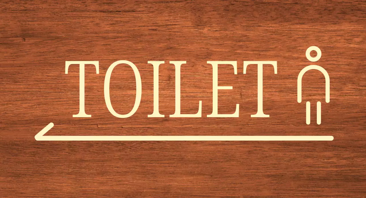 Beigefarbenes Mann-Symbol Standort der Toilette