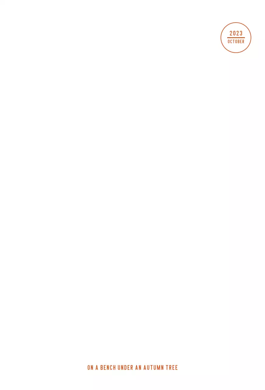 黄・赤の紅葉とベンチのある秋の公園