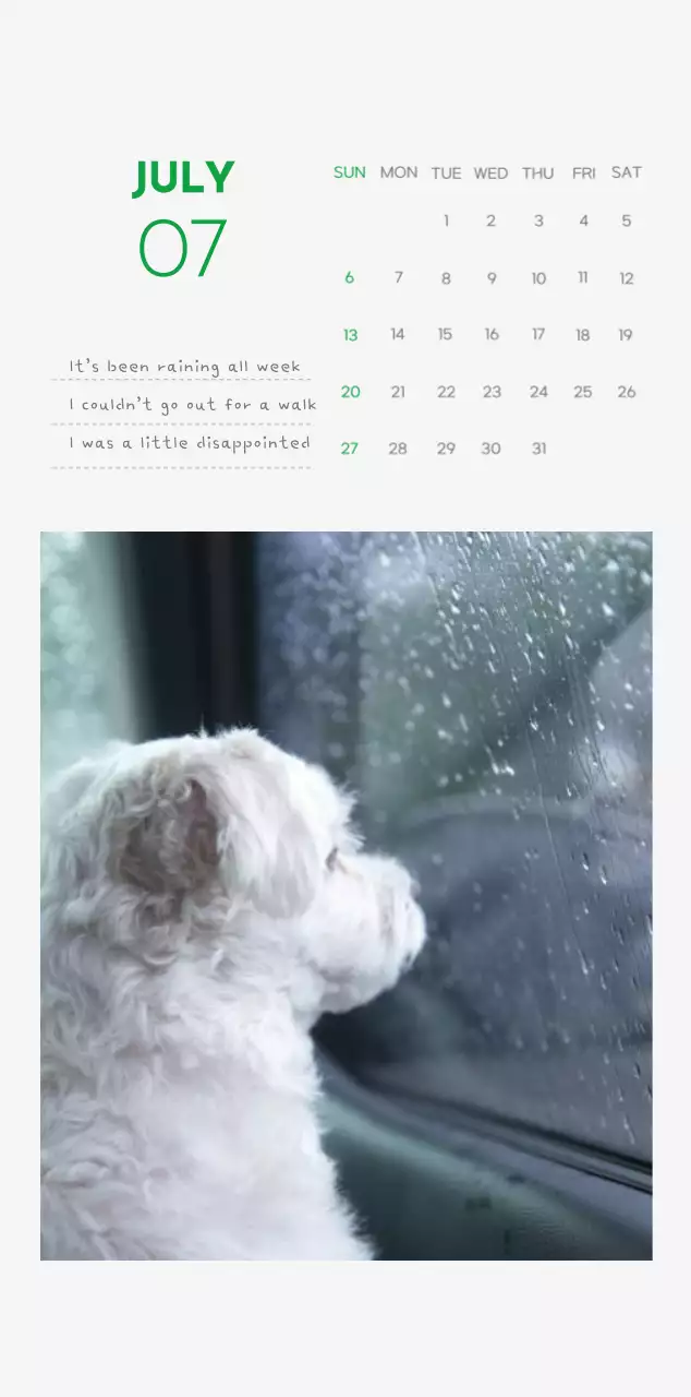 A calendar with a puppy photo and cute message in a green accent color