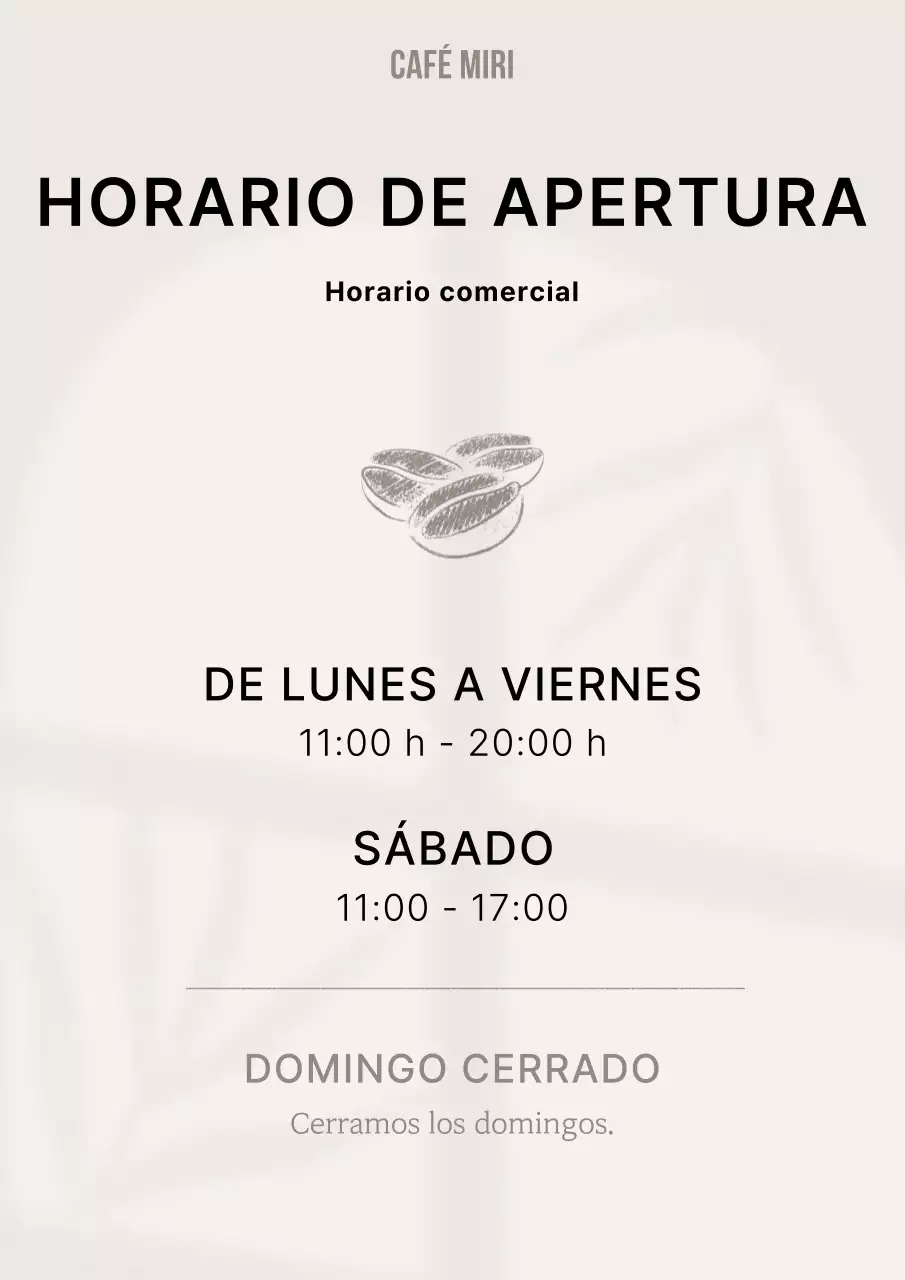 Cafetería sencilla en beige y negro con información sobre la hora de cierre