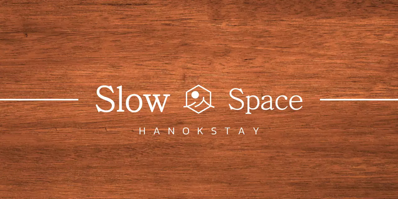 Hanok stay design with white eaves and a simplified symbolic logo of a landscape