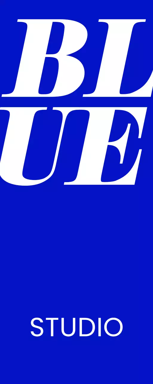 A simple storefront sign with blue and white Blue Studio text and a solid color background.