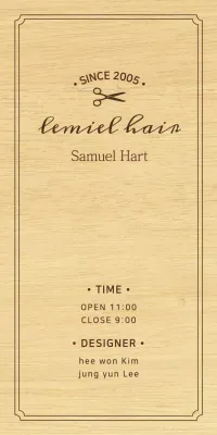 A classic-looking hair salon sign with black text and a scissors illustration