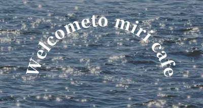 A sentimental cafe banner with a photo of glossy ocean waves.