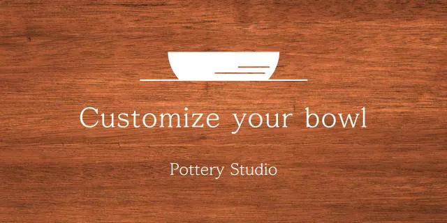 A simple workshop sign with white text and a bowl illustration