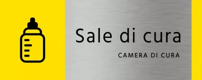 Semplice segnaletica segnaposto in giallo e nero con il nome della sala di allattamento dell'edificio e l'icona di un biberon quadrato.