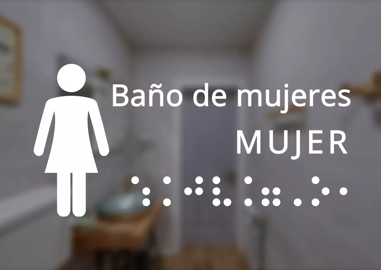 Señalización de aseos femeninos en braille con un estilo limpio