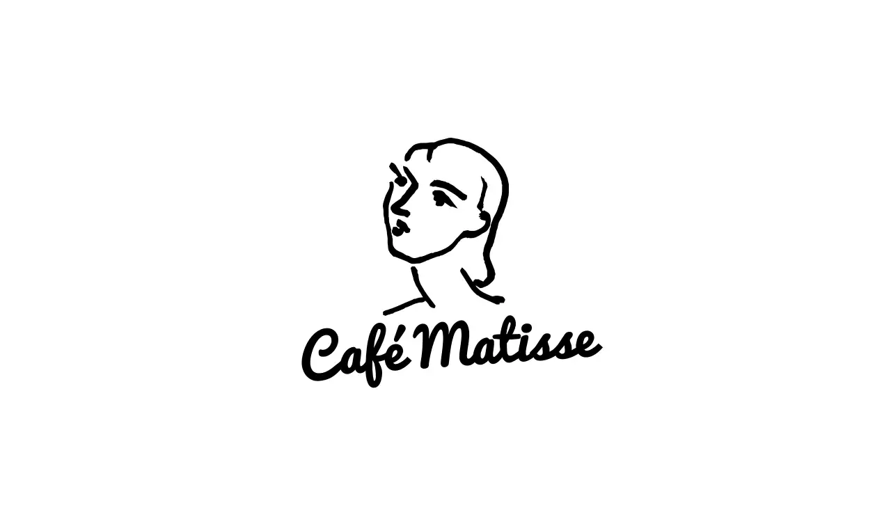 Cafetería de estilo sencillo con sentimentales ilustraciones en blanco y negro de cuadros famosos.