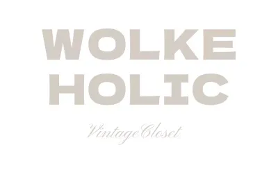 Werbung für ein hochwertiges, einfaches Bekleidungsgeschäft mit weißem und grauem Text