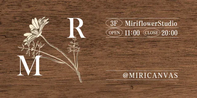 A vintage-inspired Flower Studio sign with white and ivory text and floral illustrations.