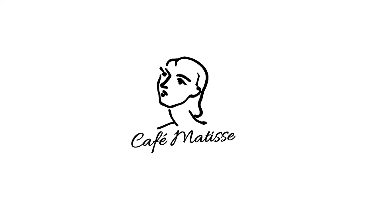 Eenvoudig vormgegeven café met sentimentele zwart-witillustraties van beroemde schilderijen